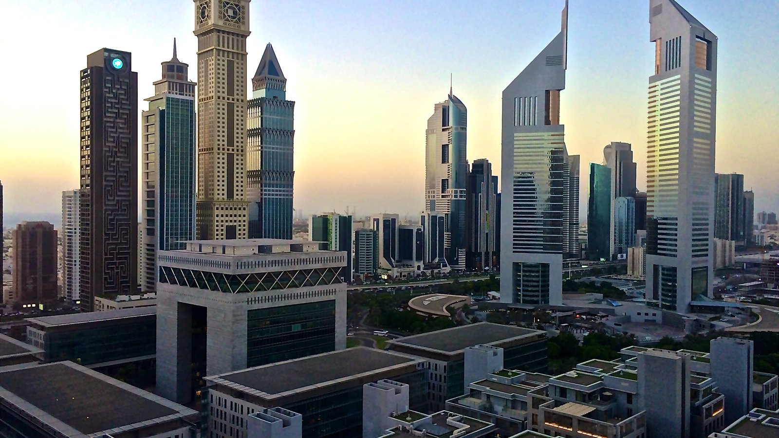 DIFC Gate Village and Emirates Towers at golden hour