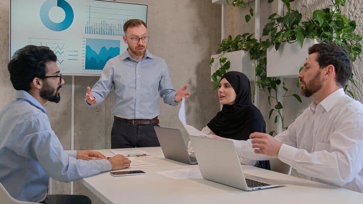 company-ceo-team-leader-analyzing-graphics-monitor-conference-briefing-diverse-business