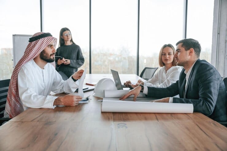 conception-teamwork-muslim-businessman-traditional-outfit-with-colleagues-office